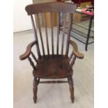 A large vintage oak farmhouse chair.