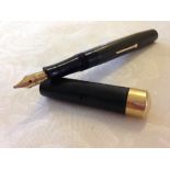 Mabie Todd ‘Swan’ Self Filling Pen c1920s.Chased black hard rubber with rolled gold trim. Clipless