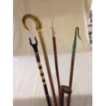 5 vintage walking sticks to include horn handled.