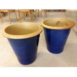 A pair of large blue ceramic gardens pots approx 50cm tall and 48cm diameter