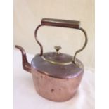 A large copper kettle.