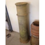 An antique buff coloured chimney pot 125cm (4' 1") tall.