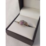 Hallmarked 9ct gold ladies dress ring set with a central pink sapphire surrounded by white, size