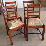 Set of 4 dark wood dining chairs with upholstered seats.