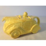 A Sadler yellow racing car teapot