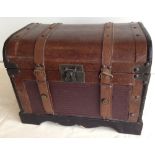 A leather chest with straps.