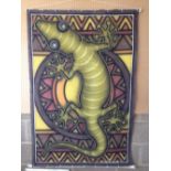 A large airbrush on material wall hanging of a lizard signed lower right, 50 x 100cm.