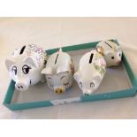4 ceramic pig money boxes/piggy banks.