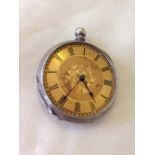 Antique silver pocket watch with engraved back, gilded face & no glass - for spares or repair.