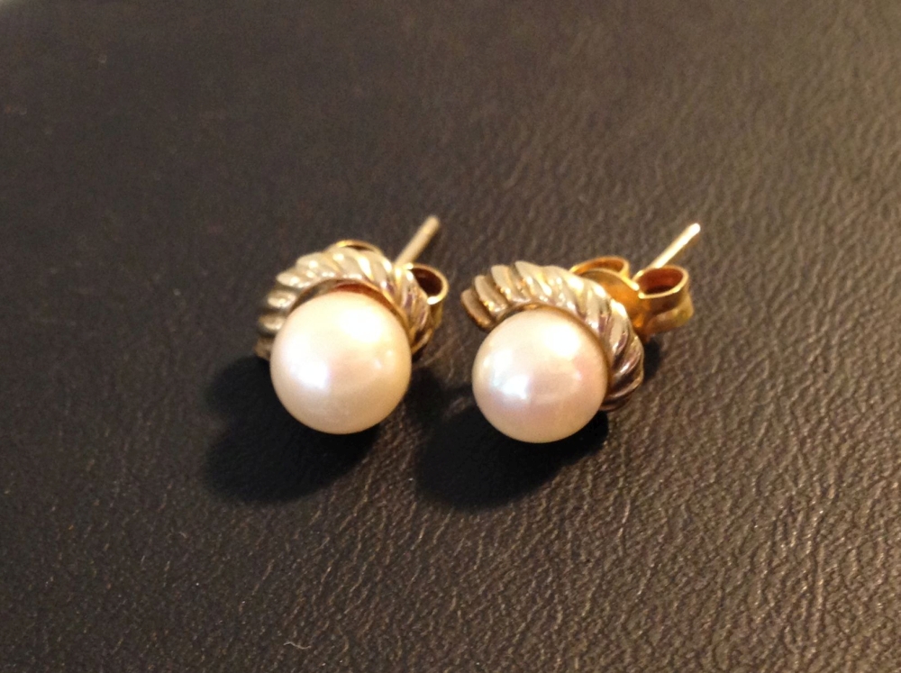 A pair of 9ct gold & pearl earrings.