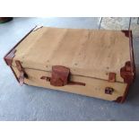 A large vintage trunk with leather corners & handles by W. H. Smith, Bath.