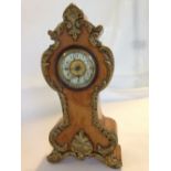 A Victorian gilt and burr walnut mantle clock, possibly French, in working order.