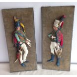 A pair of Napoleonic soldier wall plaques, 47cm tall.