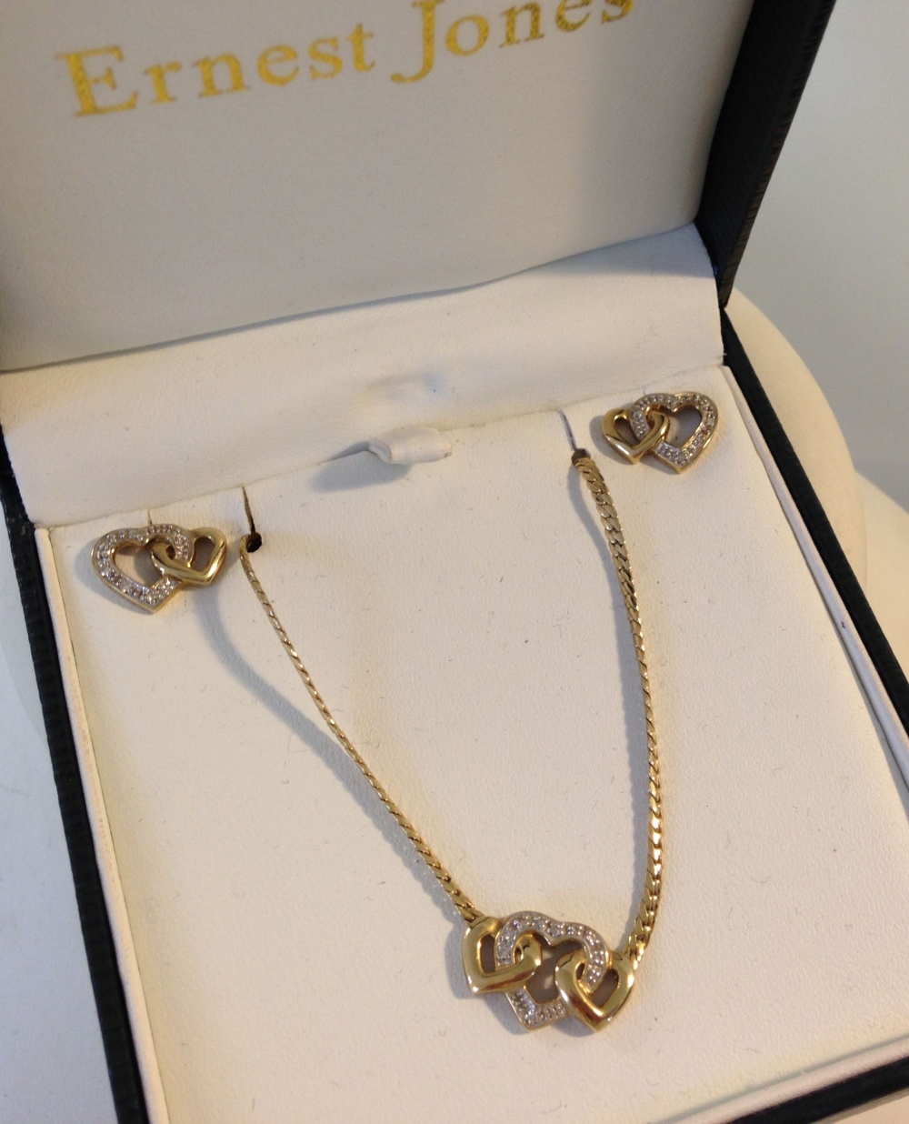 A 9ct gold & diamond linked heart necklace and earring set. Total weight approx 9g.