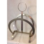 Vintage Art Deco design magazine rack in white metal.