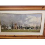A pine framed & glazed print of a village cricket match. 51 x 83cm by Ray Perry.