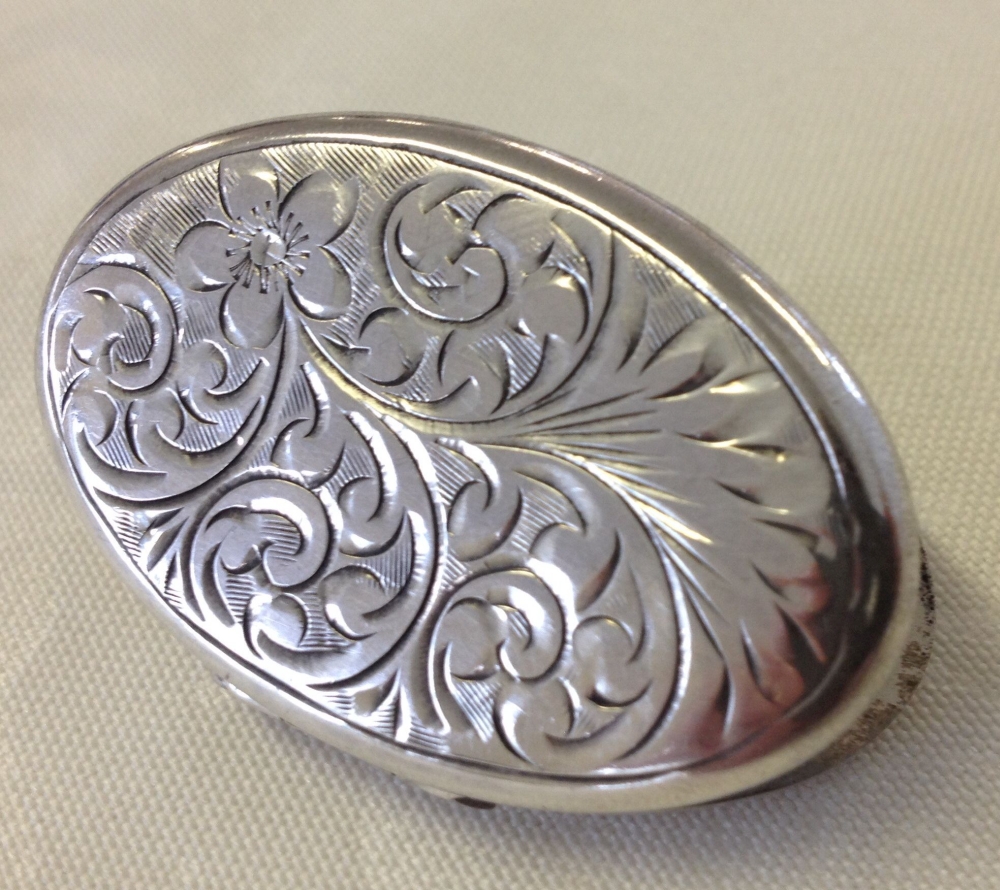 A large HM silver locket approx 4cm long.