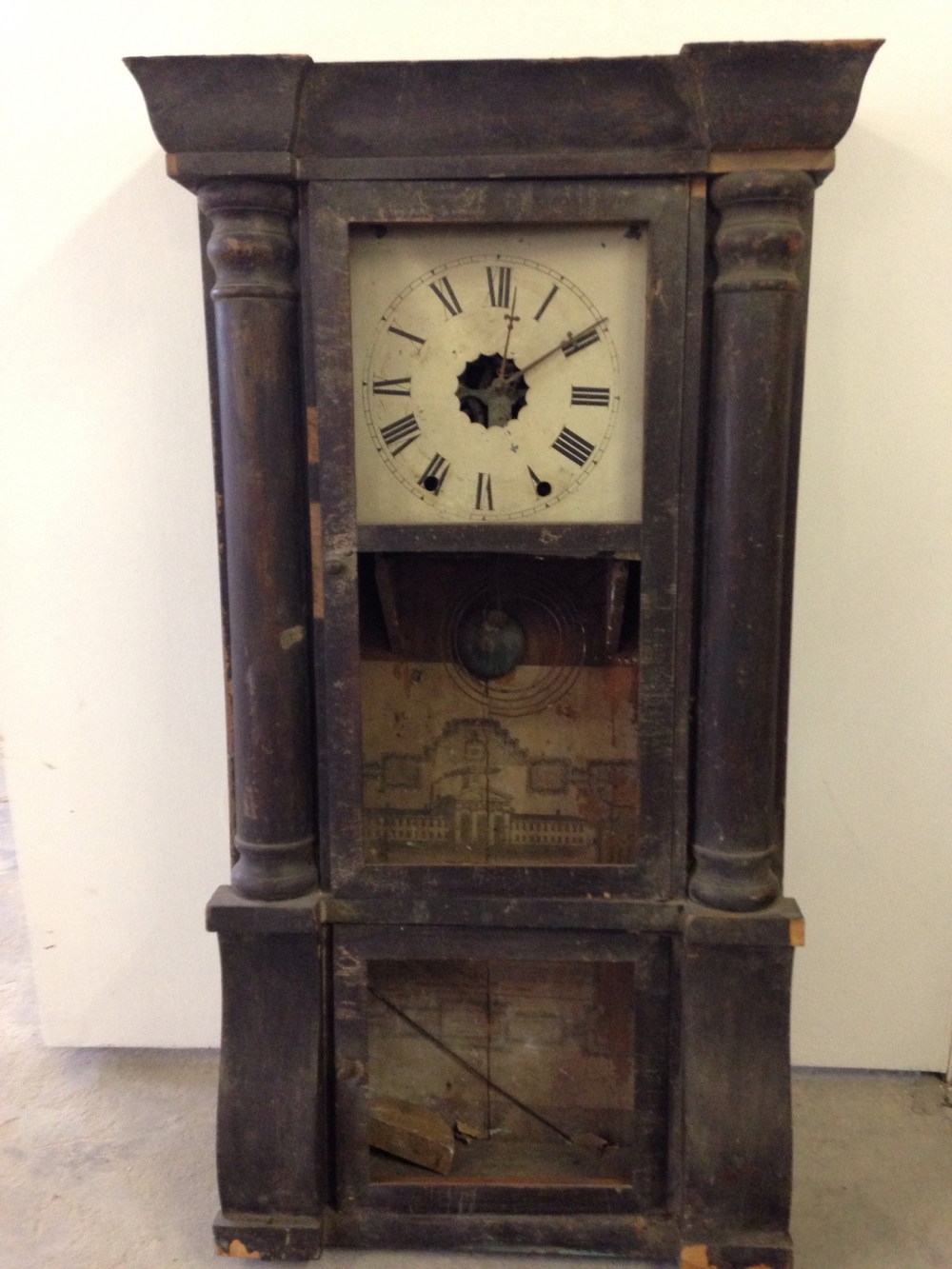A Victorian eight day wall clock by The New Haven Clock Co. USA in need of restoration.