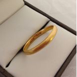 A 22ct gold wedding ring size R, approx 3.3g.