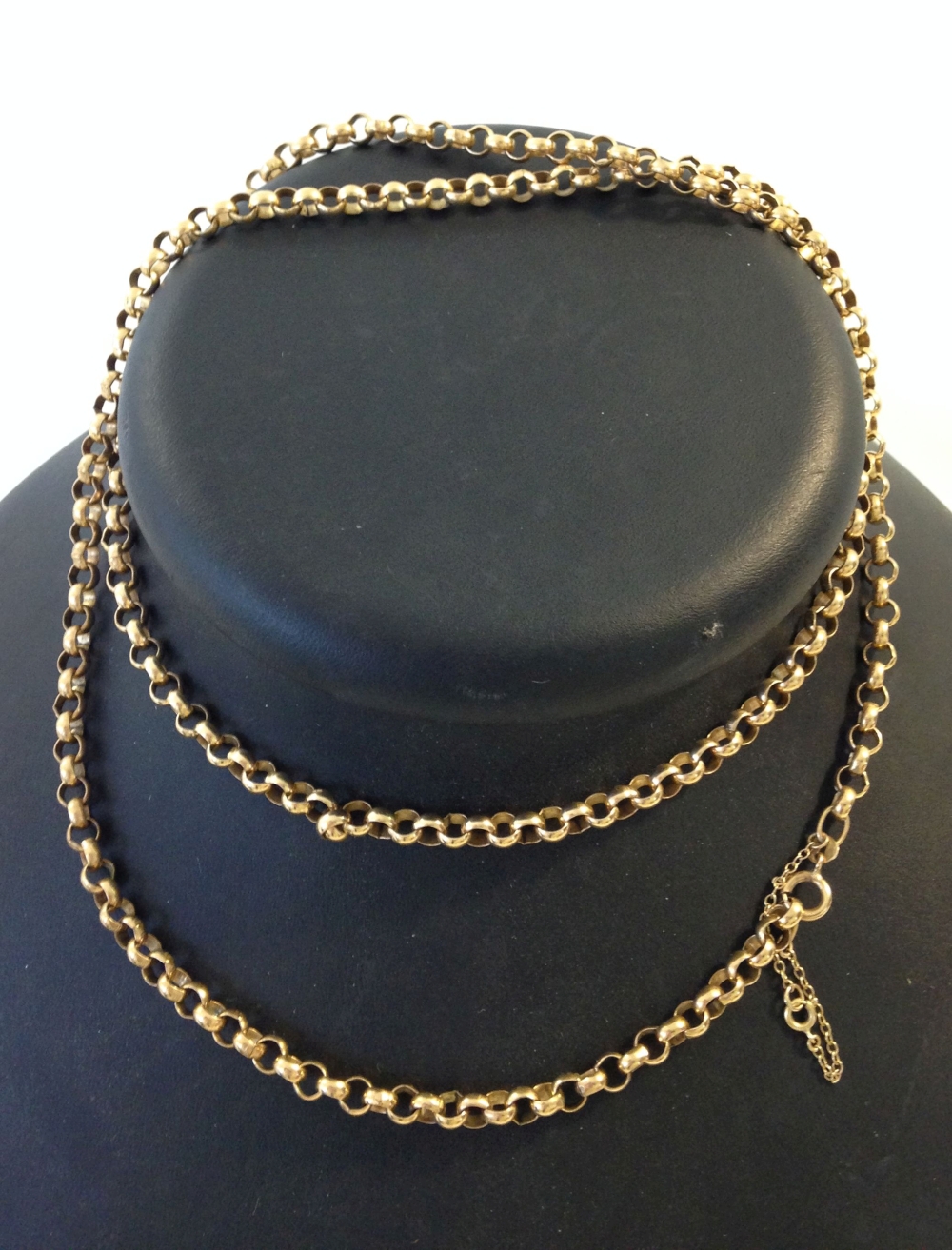 A heavy 9ct gold 32" belcher chain with safety chain, approx 42.1g.