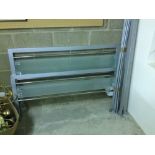 A metal & glass bed frame.