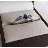 925 silver ring with central sapphire and 2 blue topaz stones, size O.