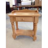 A small pine washstand 62cm wide.