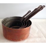 A set of 5 French vintage heavy copper saucepans.