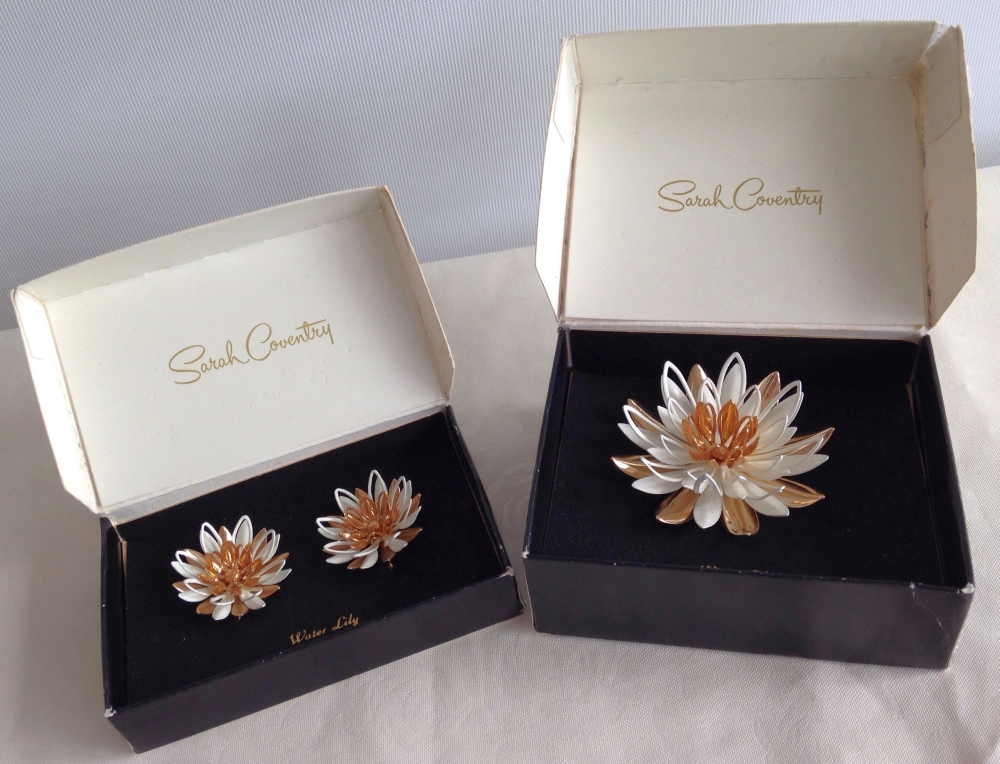 Sarah Coventry 1966 brooch & clip earrings in 'Waterlily' design in original boxes.