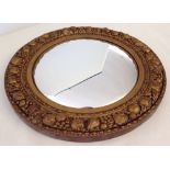 A gilt framed circular convex mirror.