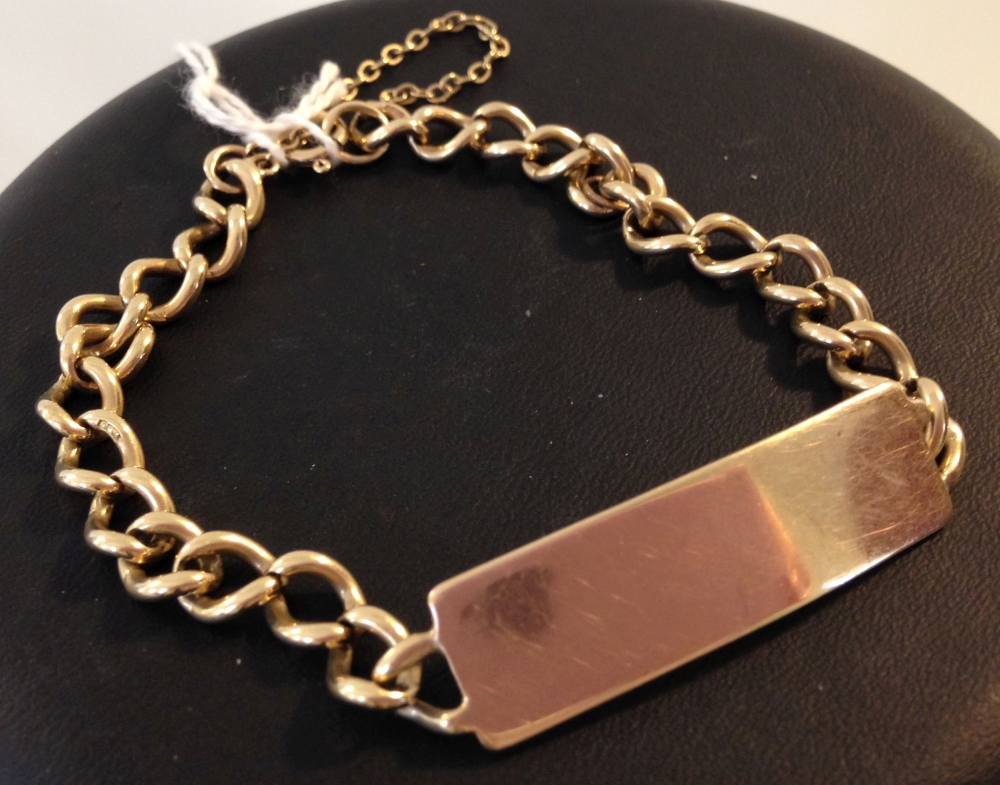 A 9ct gold identity bracelet with safety chain, approx 16.1g. Not engraved.