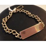 A 9ct gold identity bracelet with safety chain, approx 16.1g. Not engraved.