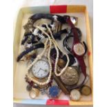 A tray of watches and costume jewellery to include a vintage Swatch watch.