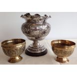 An Indian silver rosebowl c1953 with a pair of Indian brass bowls with peacock decoration.