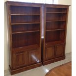 2 rosewood veneered book cases/display cabinets.