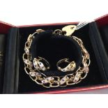 A 9ct gold double chain link bracelet set with 22 diamonds and 33 sapphires, 9ct gold lock &