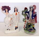 Two 19th century Staffordshire figures - Highlander spill vase and couple flatback. Both 31cm tall.