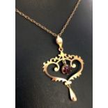 Victorian 9ct gold lavalliere set with a large garnet approx .70ct on a 14 inch 8ct gold chain.