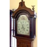 A 19th century long case clock by Symonds, Reepham. White enamel face is decorated with hand painted