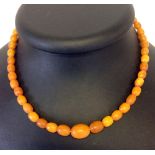 A vintage 17" butterscotch amber necklace, approx 15g, comprising 46 oval beads measuring approx 7mm