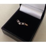 Ladies 9ct gold wishbone ring set with sapphires and white stones. Size N