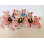 9 ceramic pig moneyboxes.