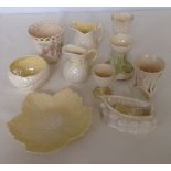 A collection of 10 small Belleek china items with various backstamps including black, brown &