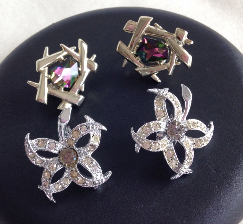 Sarah Coventry 1966 'Evening Star' clip earrings and a goldtone pair.