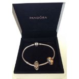 Boxed Pandora bracelet 19cm long with 2 Pandora glass charms