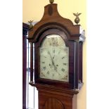 A 19th century long case clock by Symonds, Reepham. White enamel face is decorated with hand painted