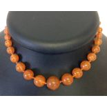 A vintage 14" Cornelian necklace hand knotted with 39 round beads in graduated sizes from 5mm to