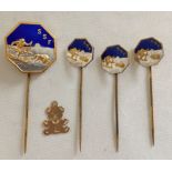 4 Swedish silver gilt Skiing pin badges with a gold flat teddy bear charm (tests as 14k). The larger