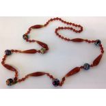 Antique 36" cut glass necklace with terra-cotta coloured glass beads of varying shapes and 7 round