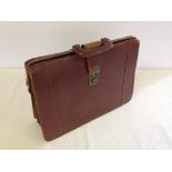A vintage brown leather briefcase.